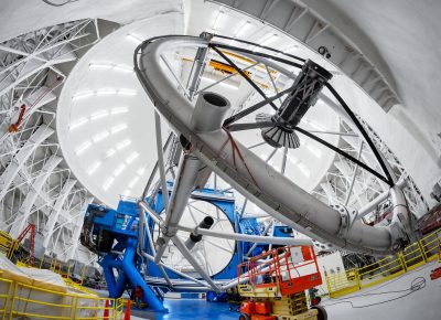 This fisheye view of the interior of the dome that houses the Gemini North telescope, one half of the International Gemini Observatory, operated by NSF’s NOIRLab, showcases the impressive size and complex design of the telescope and its dome.